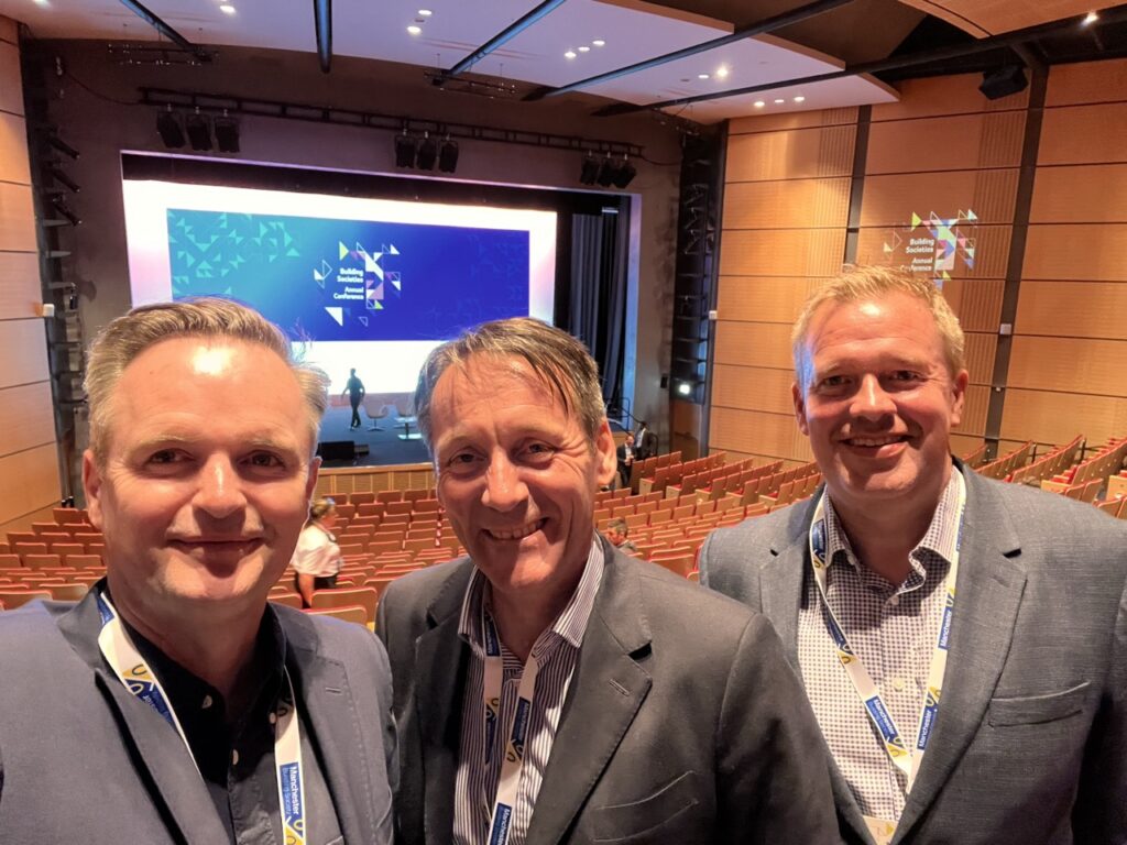 Image of Whitecap Director Julian Wells, Rob Pheasey, Chair of the BSA and CEO of Marsden Building Society and Whitecap Director Stefan Haase grouped at the BSA Conference
